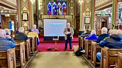 Dolores Long and Graham Briggs pictured speaking at Oldham Parish Church