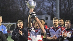 Martyn Ridyard parades the Law Cup silverware