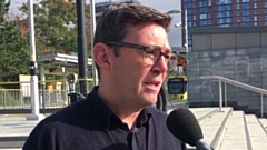 Greater Manchester mayor Andy Burnham pictured at the MediaCityUK Metrolink stop