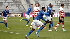 George Elokobi celebrates scoring a goal during his spell as a Latics player