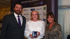 Julie Stansfield (centre) receives her award from Nick Knowles and Jo Delbridge (Specsavers)