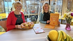 Lynn and Suzanne pictured at the Maggie's Oldham Kitchen Table