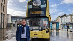 Greater Manchester mayor Andy Bunrham with the first Bee Network branded bus in Bolton on Friday