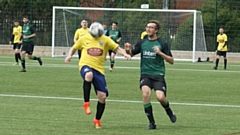 HEAD THE BALL: Action from the game between Oldham Saints and Village Manchester reserves. Village won 6-2, but Saints recovered well from a 5-1 interval deficit