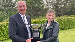 Emily receives her trophy from David Whaley, secretary of the Oldham and District Golf Society and the former Managing Editor of the Oldham Chronicle