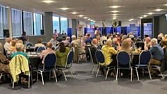 Radio Cavell chairman Kent Wells delivers a speech to the Oldham Event Centre party-goers