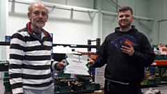 Saddleworth Rotary Club President Ian Brett and Foodbank Manager Tom Lewis-Hood accepting £500 worth of Aldi vouchers on behalf of the Foodbank