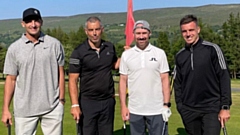 Rugby star George Ford (right) is pictured with one of the teams