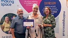 Cath Magee is pictured collecting Sue O'Sullivan's award from charity Making Space