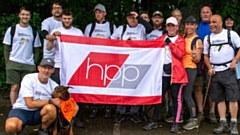 The HPP walkers proudly fly the flag before embarking on the charity challenge