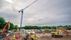The crane - which is ten times the height of a double-decker bus - is in place to deliver early construction work at the West Vale affordable housing development