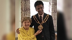 Annie 'Nan' Schofield is pictured with the Mayor of Oldham, Councillor Zahid Chauhan OBE
