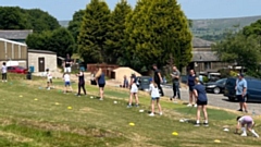 The girls' session is under way on the excellent practice ground at Saddleworth