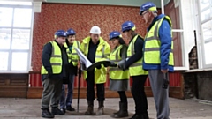 Oldham Council leader, Councillor Arooj Shah, is pictured (third from right) with some of the restoration team