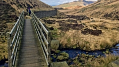 A footbridge over Chew Brook