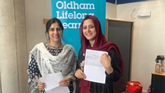 Madiha Ali (left) and Maliha Latif pick up their maths results