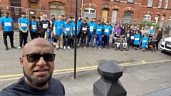 'Running Man' Afruz Miah with the group of walkers who set off from the scene of the devastating fire on Saint Thomas Street North