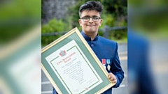 Ibby Yousaf proudly shows off a Civic appreciation award he received earlier this year. Image courtesy of Darren Robinson
