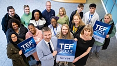 Flanked by UCO staff and learners, Susan Holden (Assistant Principal HE and Higher Skills at UCO) and Simon Jordan (Principal and Chief Executive at Oldham College) celebrate TEF Silver at the University Way site
