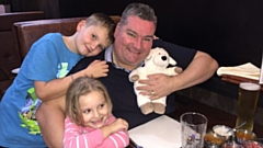 Happier times: Neil is pictured with his children Owen and Holly 