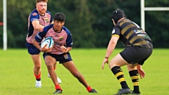 Oldham's Arjun Mistry looks for a gap in the Leigh defence