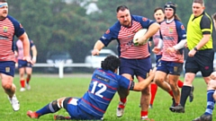 Oldham's Stuart Brennan makes a rare break