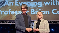 Lucy Lees, Mahdlo CEO, presents Professor Brian Cox with a memento of him becoming an Honorary Patron of the charity
