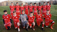 Chadderton Football Club's under-15s squad show off their new strip