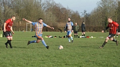 Action from the clash between Old Strets reserves (red and black) and Oldham outfit Santos