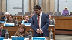 Councillor Abdul Jabbar, cabinet member for finance. Councillor Barbara Brownridge is seated next to him in the council chamber