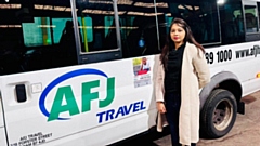 Pooja Sharma shows the flyer on one of the AFJ coaches