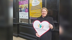 Funeral Director Pauline Lawrence outside Elizabeth Way and Company Funeral Directors in Stamford Street, Mossley