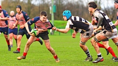 Young scrum half Lewis Ward is pictured in the thick of the action