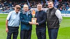 Roy is pictured (second left) with Manchester FA CEO Colin Bridgford, Latics chairman Frank Rothwell and CEO Darren Royle