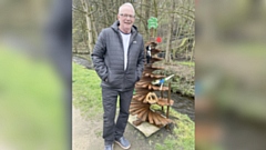 Retired joiner Chris Bannatyne pictured with the rebuilt tree