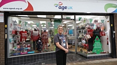 Jenna Boyle, shop manager of Age UK Chadderton, and the Christmas window display