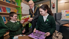 The Mayor of Oldham, Councillor Eddie Moores, celebrates the arrival of 200 new books as part of Bookmark Reading Charity’s Your Story Corner programme