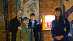 Scott Woodhead, Owner of Sports Physio UK and Co-Founder/Chairman of Defibrillators Save Lives, is pictured with his son Charlie, Sarah Hince and her son Tomas