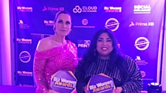 Felix Robinson presents Rubena with one of her Young Entrepreneur of the Year awards