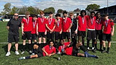 The jubilant Radclyffe School Year 11 boys football team celebrate their dramatic victory