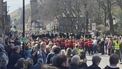 The scene as delighted crowds lined Uppermill High Street. Images courtesy of Julie Bradders / Alison Broadbent