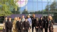 Staff and pupils from The Oldham Academy North are pictured outside the school