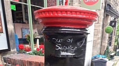 The letter box at the Dobcross Village Store and Post Office