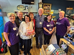 Chair of the Board of Trustees David McDonald with volunteers from Dr Kershaws' Royton shop